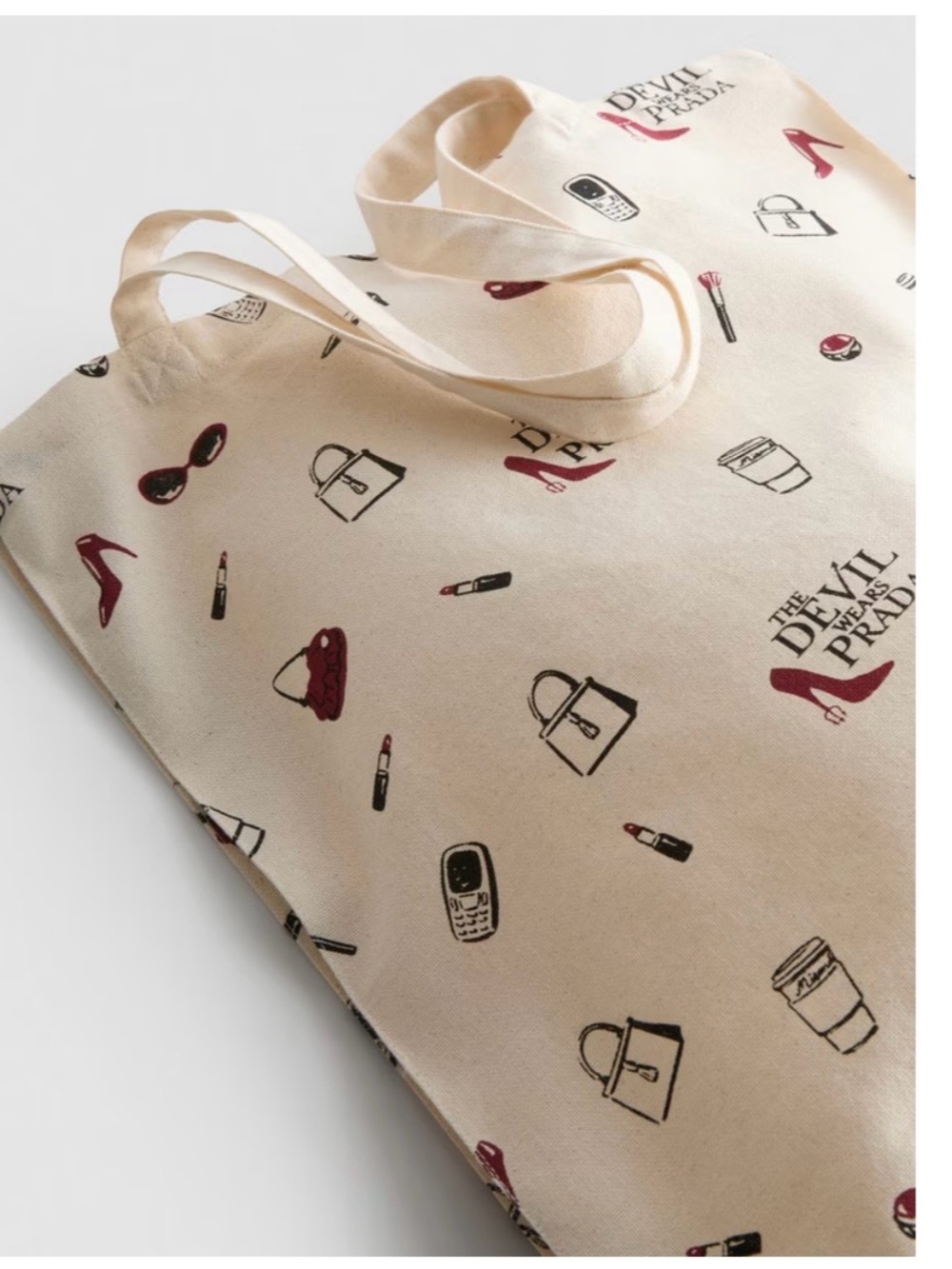 The Devil Wears Prada Cream Canvas Tote with Red Accent Prints - Picture 3 of 3